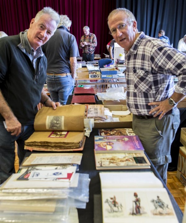 Committee member Mick Stone looks over Mark Burgess' stall. Mark is also a Sydneysider and will be at the October fair.